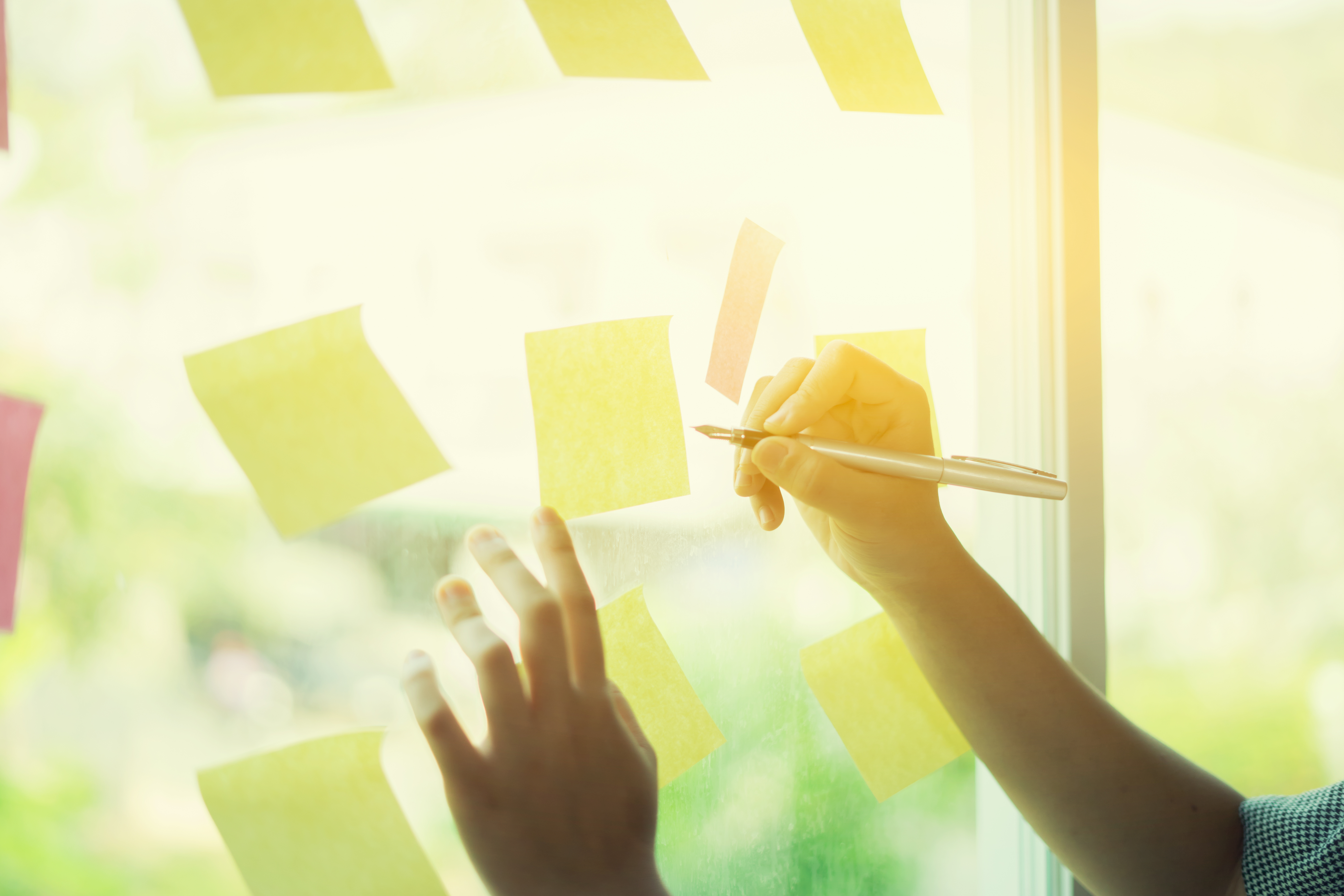 business-people-meeting-office-use-post-it-notes-share-idea