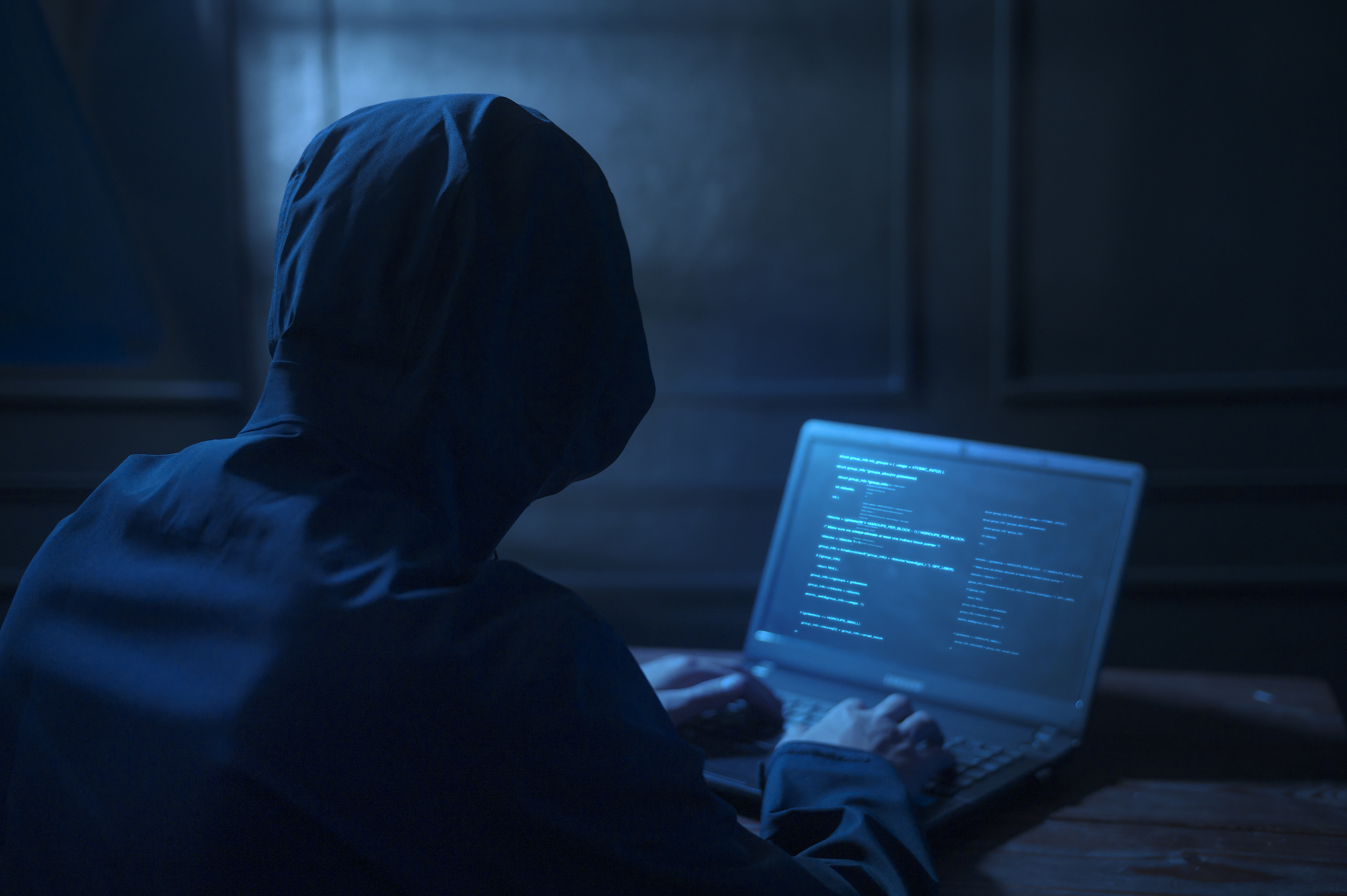 hacker-is-using-laptop-computer-steal-data-night