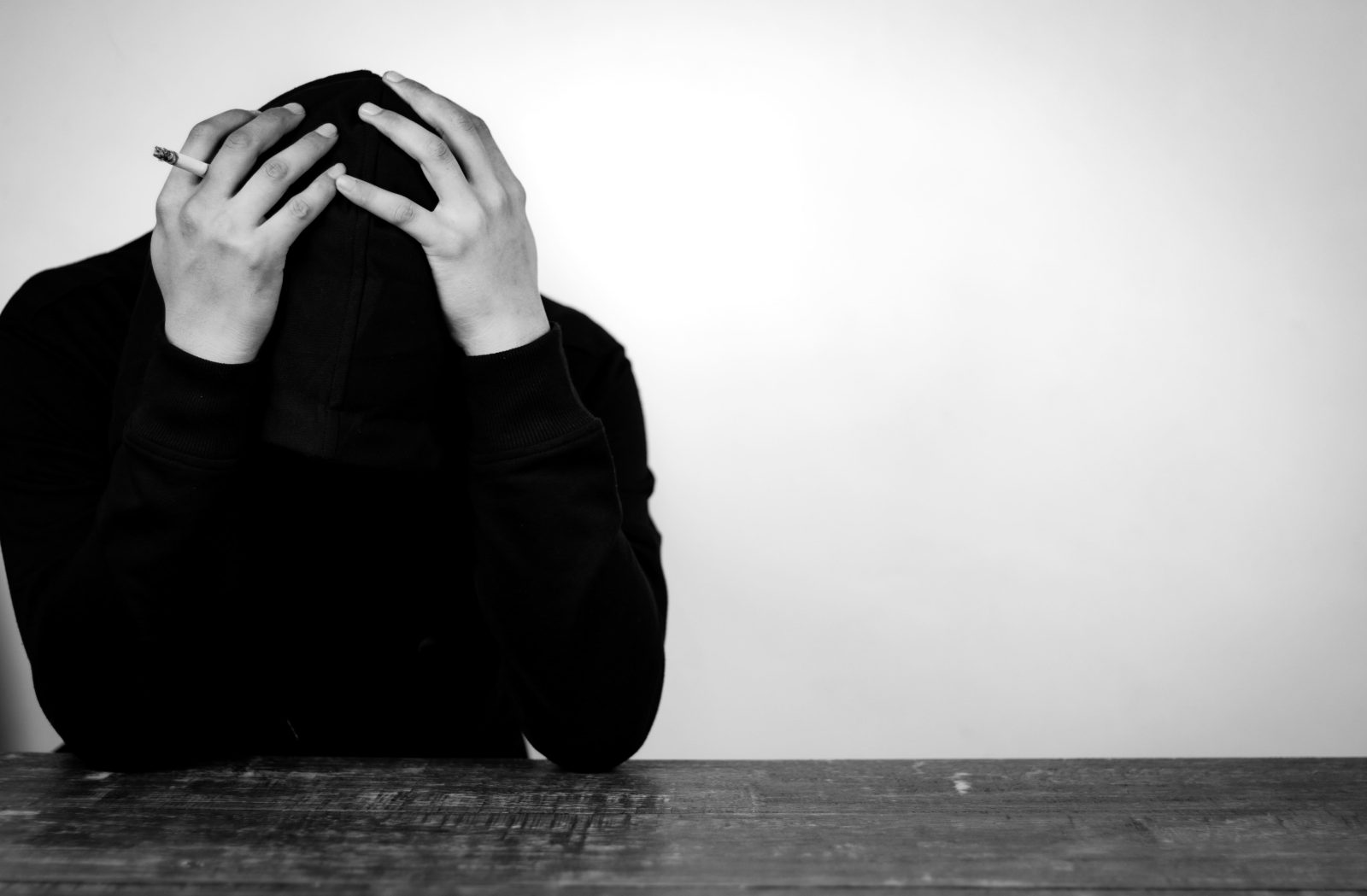 depressed-man-black-hoodie
