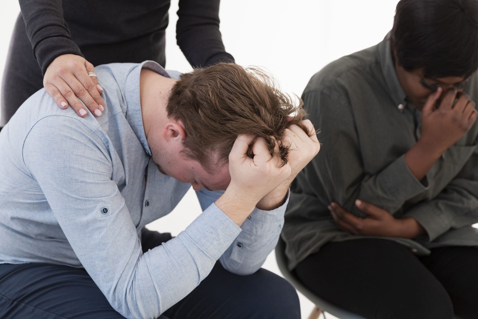 female-hands-consoling-sad-male-patient
