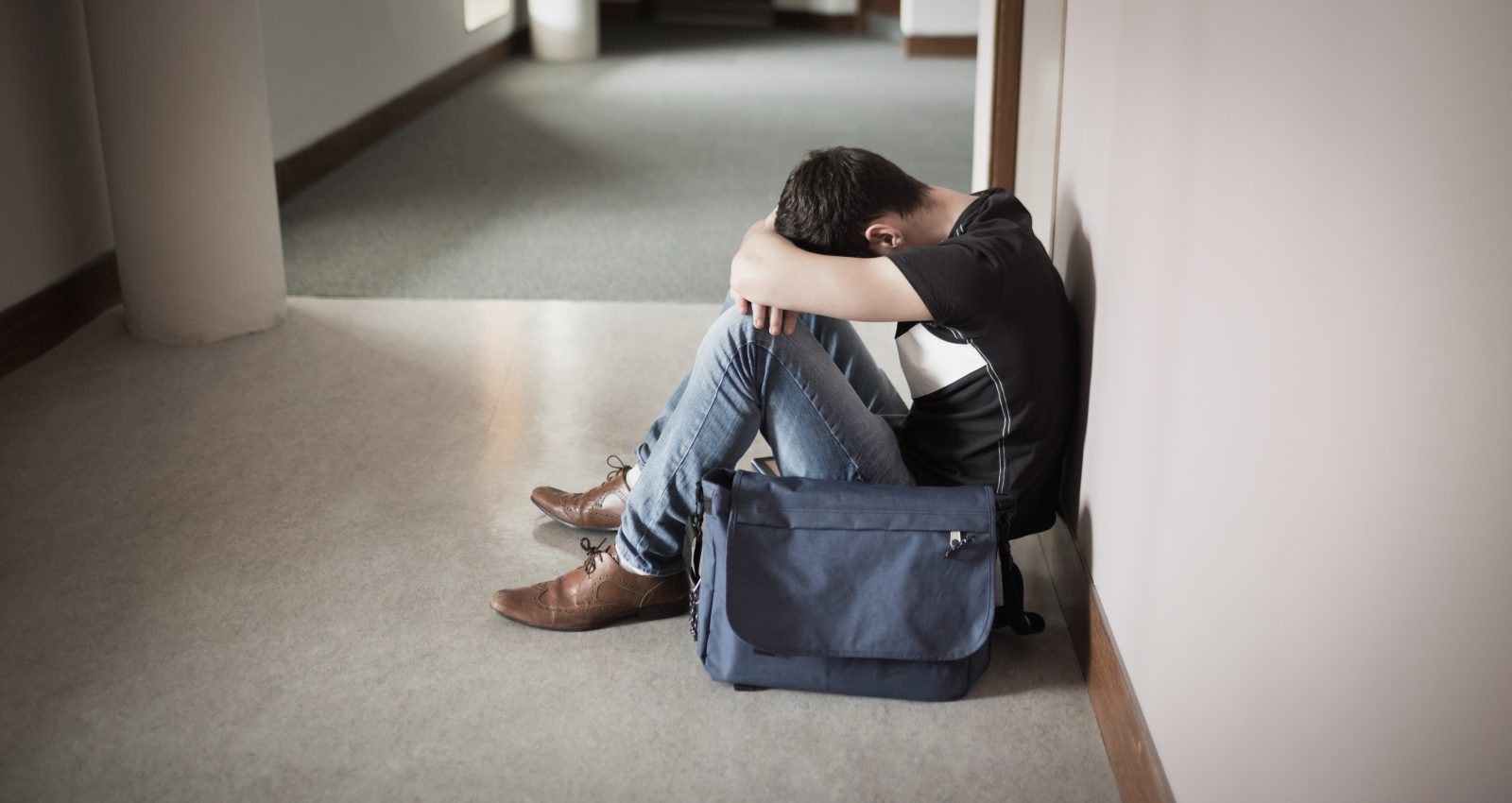 depressed-male-student-with-head-knees