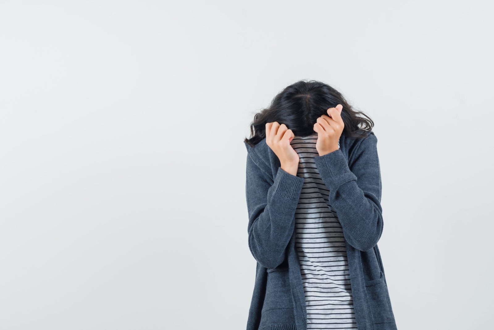 little-girl-hiding-face-her-collar-t-shirt-jacket-looking-frightened
