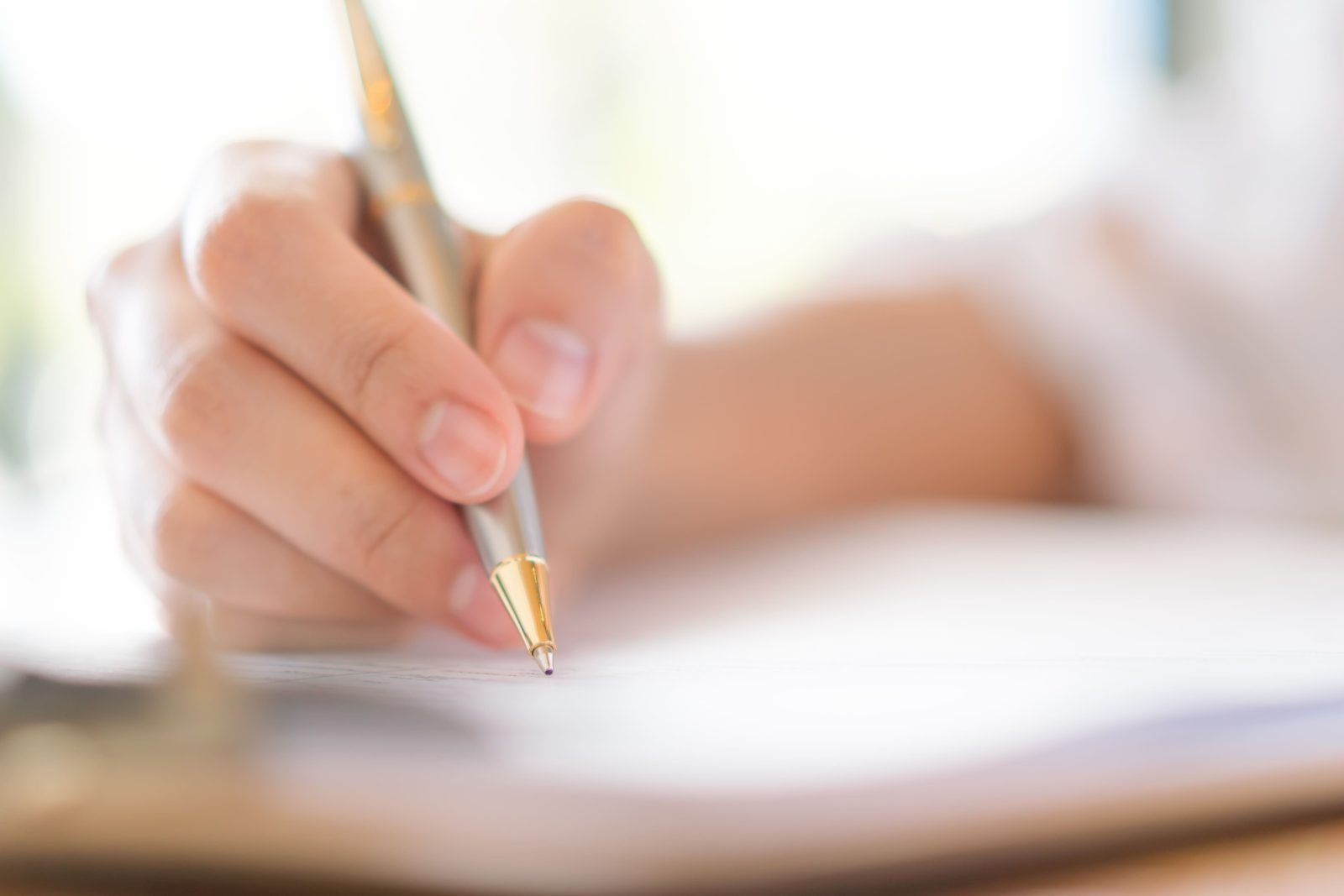 hand-with-pen-application-form 1