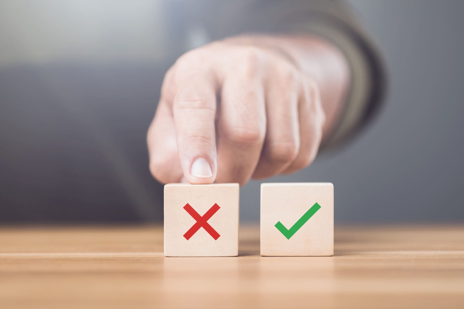 man-choosing-checkmark-x-symbol-wooden-blocks-image-represents-concept-making-right-choice-highlighting-importance-distinguishing-right-wrong
