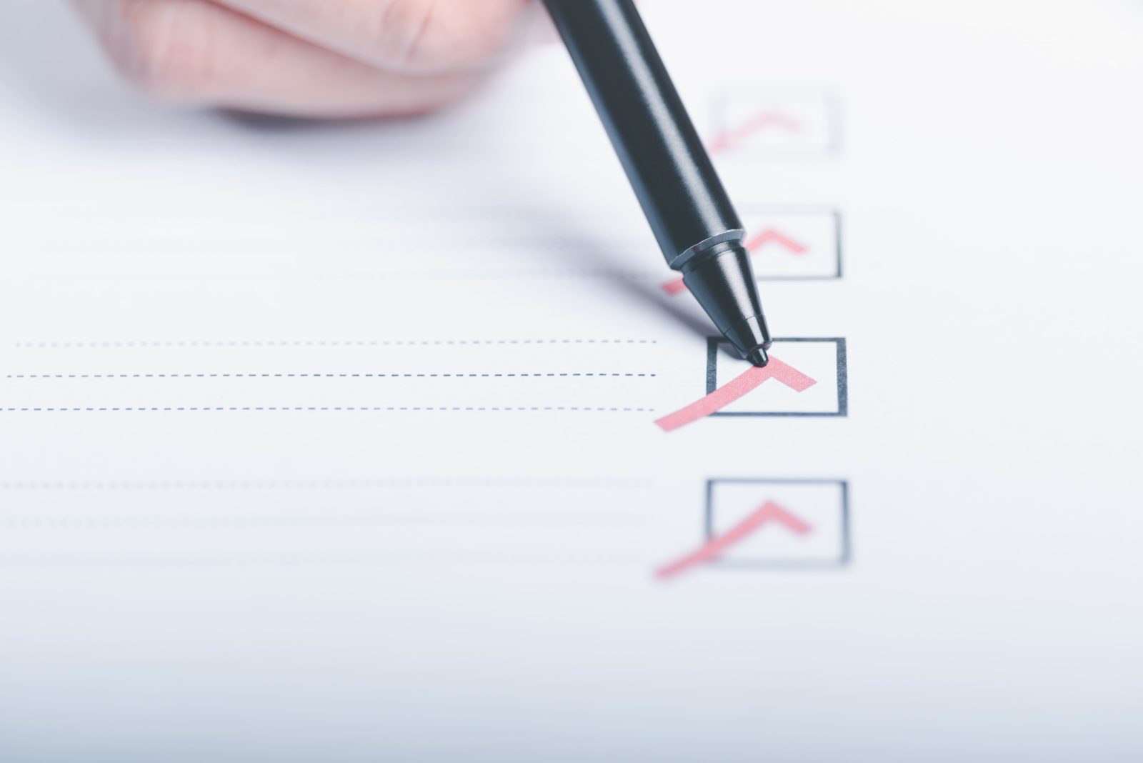 human-hand-check-mark-papercheck-concept-through-checkboxes-surveys-through-questionnaires-t