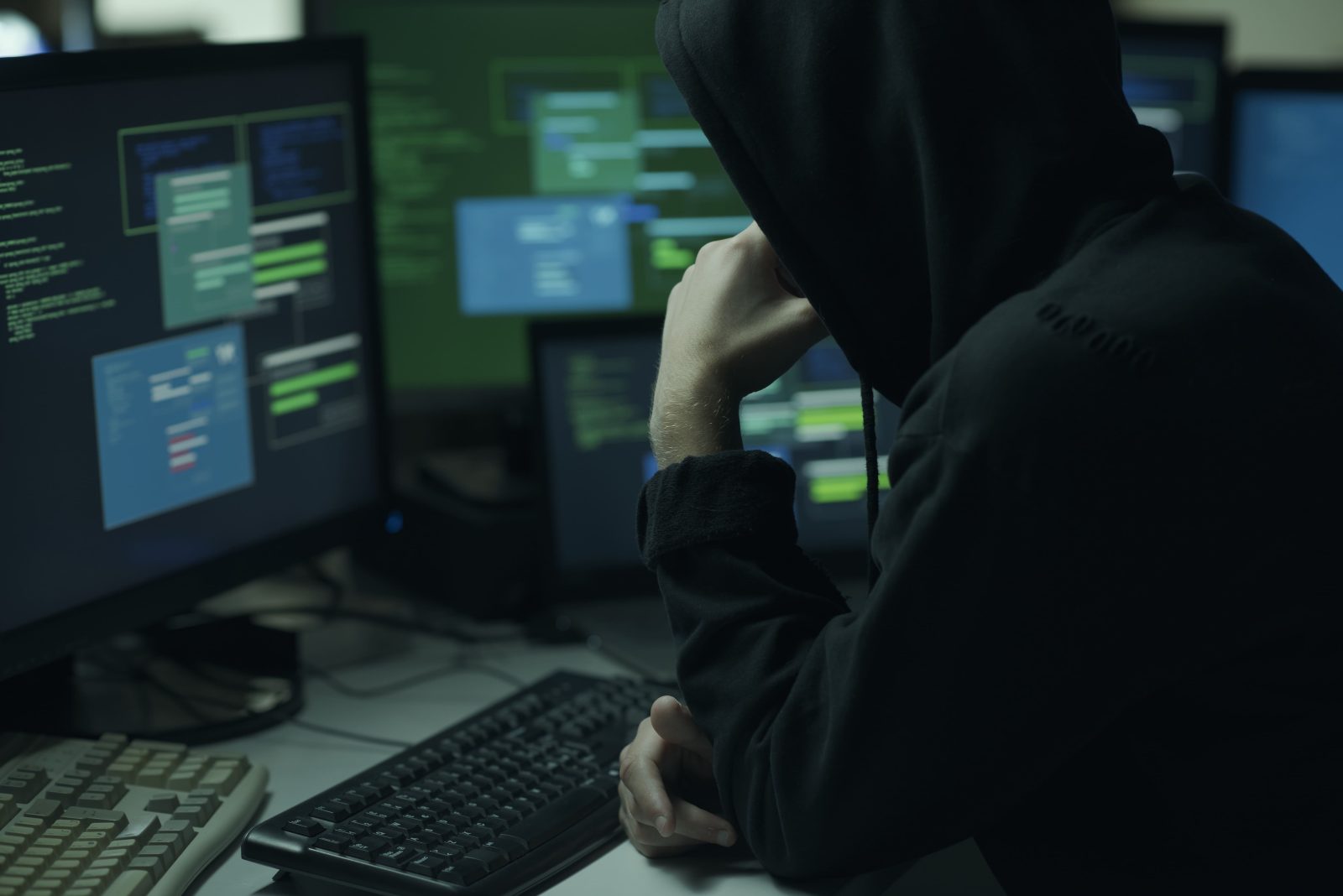 hacker-with-hoodie-working-with-computer