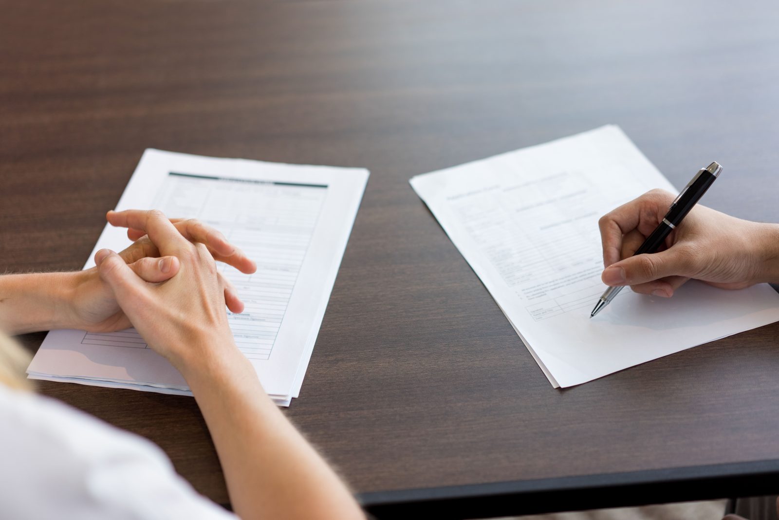 female-hand-filling-questionnaire-male-candidate