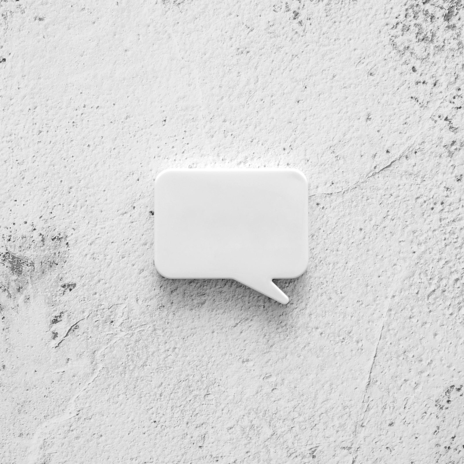 concrete-surface-with-chat-bubble