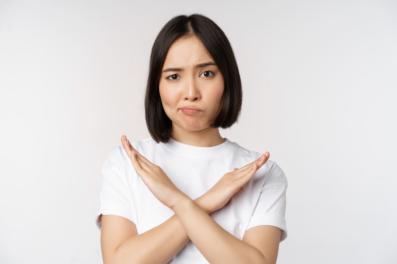 portrait-asian-korean-woman-showing-stop-prohibition-gesture-showing-arm-cross-sign-standing-tshirt-white-background-copy-space